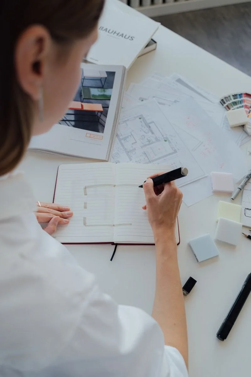 Interior designer reviewing plans and material samples